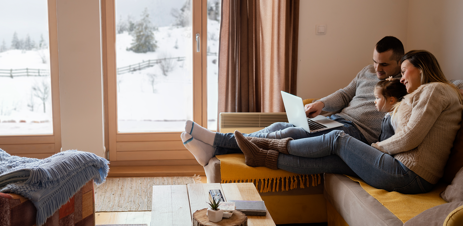 Protect Your Family From Viruses This Winter - Family on Couch
