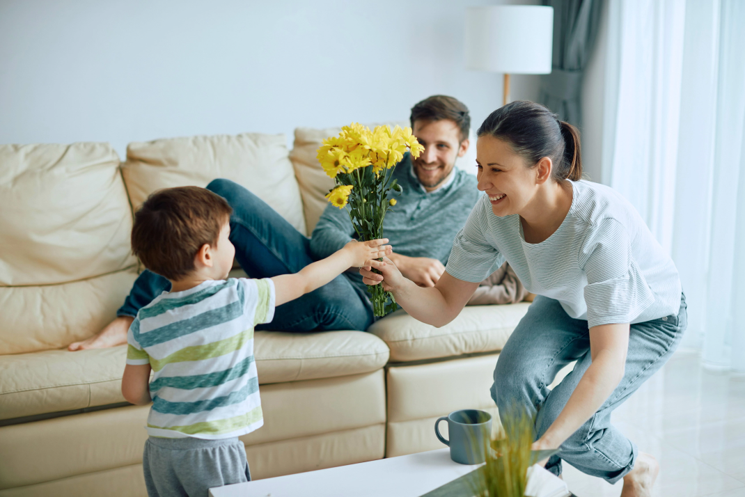 Child giving Mother Flowers