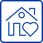 Blue line-art icon depicting a house with a heart in front, symbolizing comfort, care, and home living.