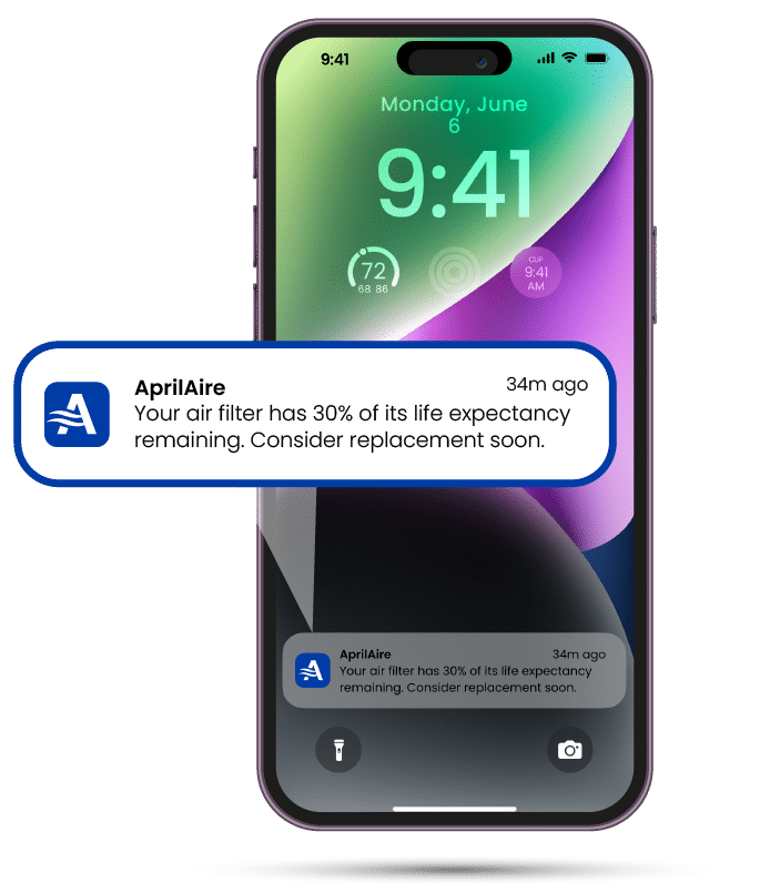 A smartphone displays an AprilAire notification stating an air filter has 30 percent life expectancy remaining.