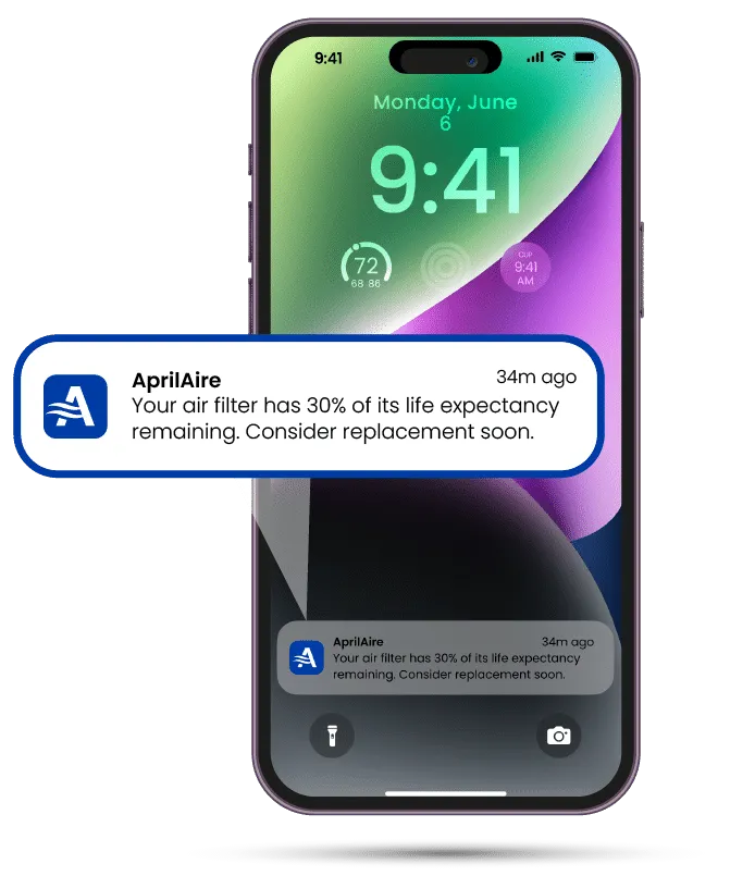 A smartphone displays an AprilAire notification stating an air filter has 30 percent life expectancy remaining.