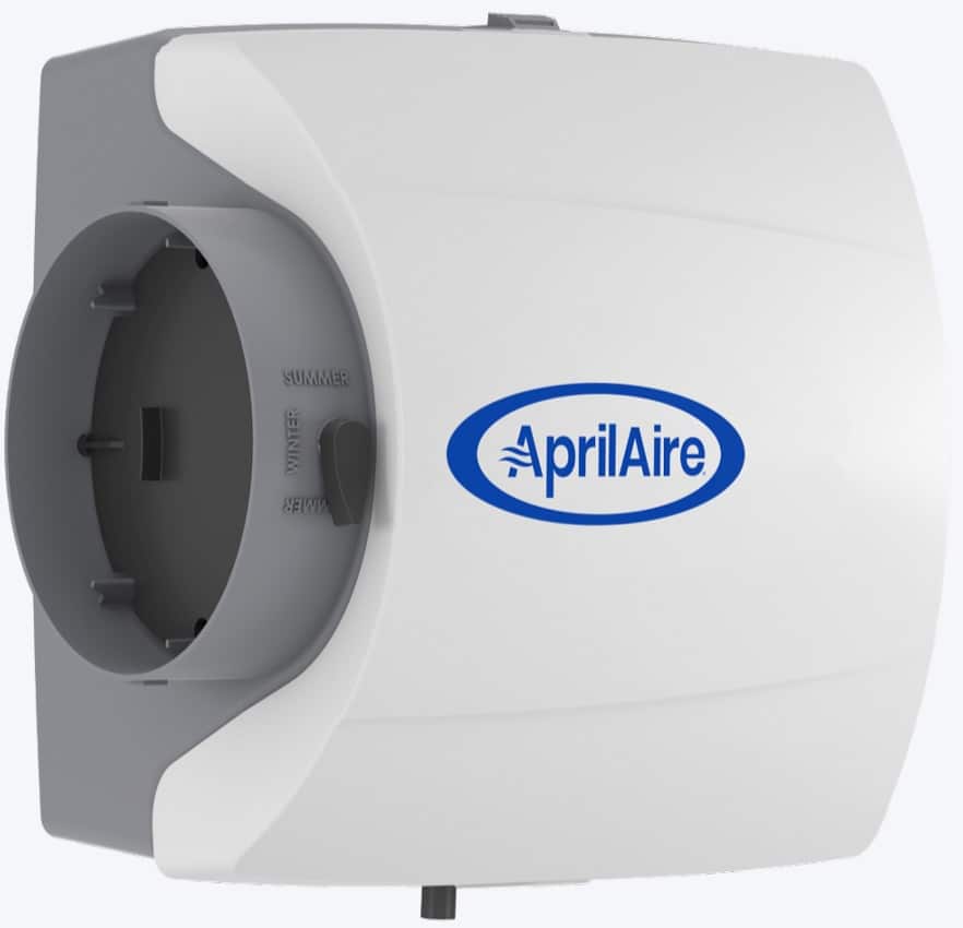 White and gray AprilAire bypass humidifier with a seasonal winter and summer damper switch on the side duct.