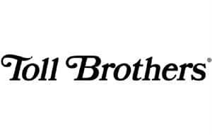 The words Toll Brothers in a sophisticated black script-style serif font with decorative flourishes on the capital letters.